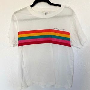 White tee with rainbow stripe